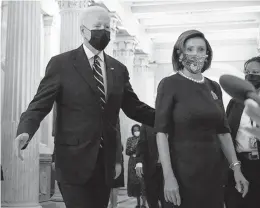  ?? SARAHBETH MANEY/THE NEW YORK TIMES ?? President Joe Biden and House Speaker Nancy Pelosi exit Thursday from a meeting with the House Democratic Caucus in Washington, D.C.