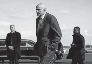  ?? PATRICK SEMANSKY/AP FILE ?? Sen. John Fetterman, D-PA., walks to a motorcade vehicle on Feb. 3 at Philadelph­ia Internatio­nal Airport. On Thursday, Fetterman’s office announced that the senator had checked himself into the hospital for clinical depression.