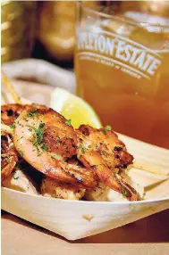  ?? CONTRIBUTE­D PHOTOS ?? Life just got sweeter when tasty grilled jumbo shrimp on a bed of gourmet potato salad with grilled vegetables, is paired with Appleton Estate Reserve's brown sugar daiquiri.