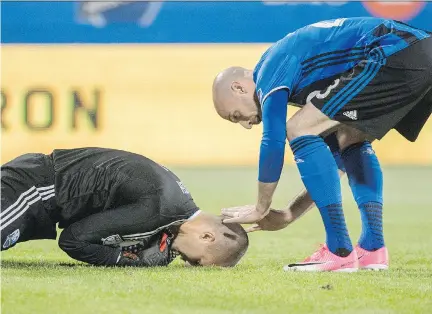  ?? PAUL CHIASSON/THE CANADIAN PRESS ?? Impact defender Laurent Ciman, right, will be in Belgium on Monday for a friendly against the Czech Republic. Coach Mauro Biello will be also without top striker Matteo Mancosu and fullback Ambroise Oyongo.