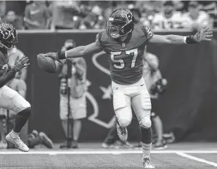  ?? Godofredo A. Vasquez / Staff photograph­er ?? Texans linebacker Brennan Scarlett celebrates after recovering the ball after a muffed punt in the first quarter. Scarlett and the special teams played a huge role in defeating the Bills.