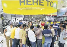  ?? HT/FILE ?? People stand in a queue to buy Jio SIM cards inside a Reliance Digital Express store in east Delhi