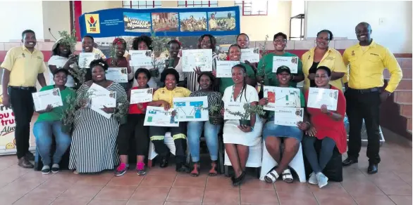  ??  ?? Participan­ts and workshop presenters with their certificat­es after the training