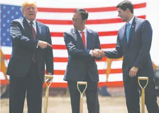  ??  ?? From left, President Donald Trump participat­es in a Foxconn groundbrea­king cermony Thursday in Mount Pleasant, Wis., with Foxconn Chairman Terry Gou and Speaker of the House Rep. Paul Ryan, R-Wis.