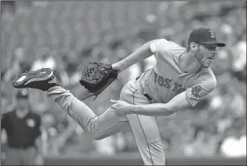  ?? Associated Press ?? Follow through: Boston Red Sox starting pitcher Chris Sale follows through on a pitch to the Baltimore Orioles in the second inning of their game Wednesday in Baltimore.