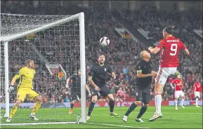  ??  ?? HEADS I WIN: Zlatan Ibrahimovi­c nods in the winning goal for Manchester United