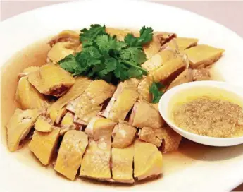  ??  ?? > FROM PAGE 17 The elegant simplicity of a simple poached chicken, eaten with lots of minced ginger.