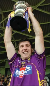  ??  ?? Wexford captain Diarmuid Lyng raises the silverware.