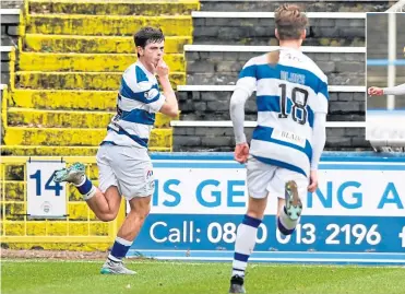  ??  ?? Morton’s Craig Mcguffie, left, celebrates opening the scoring with Cameron Blues