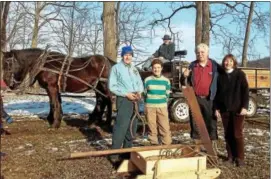  ?? KOLLEEN LONG DIGITAL FIRST MEDIA ?? The Dreibelbis Farm Historical Society, including members (from left) Mark Dreibelbis, Janine Dreibelbis, Steve Burkholder (on wagon), Ned Dresher and Nancy Dresher, welcomed guests to the property for an ice harvest demo on Saturday, Feb. 11.