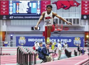  ?? (NWA Democrat-Gazette/Hank Layton) ?? Arkansas freshman Jaydon Hibbert won the SEC men’s triple jump Saturday at the Randal Tyson Track Center in Fayettevil­le. Hibbert had a personal-best and collegiate-leading mark of 56 feet, 11/ inches. 4