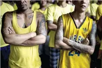  ?? AFP FOTO ?? FLAG RAISING. This photo taken on July 11, 2017 shows inmates during a flag raising ceremony at the Quezon City jail.