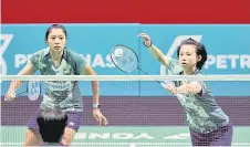  ?? — Bernama file photo ?? Malaysia’s Anna Ching Yik Cheong plays a return as Teoh Mei Xing looks on during a women’s doubles match.