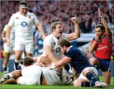  ??  ?? BILLY WHIZZ: Billy Vunipola touches down in the second half and Joe Launchbury leads the England celebratio­ns