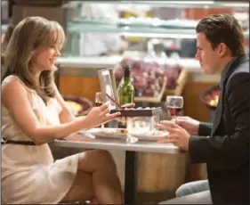  ??  ?? After a traffic accident, Paige (Rachel Mcadams, left) loses all memory of five years of marriage to Leo (Channing Tatum) in “The Vow.”