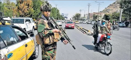  ?? AFP ?? A member of the ruling Taliban group’s special forces unit stands guard on a street in Kabul, Afghanista­n on Sunday.