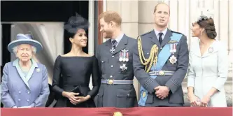  ??  ?? BRITAIN’S Queen Elizabeth watches a fly-past of Royal Air Force aircraft over Buckingham Palace in London with Meghan the Duchess of Sussex, Prince Harry, Prince William and Kate the Duchess of Cambridge. | AP