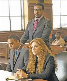  ?? Fox ?? MADELINE SCOTT (Rachelle Lefevre) with series guest star Jason Woods, from left, and legal partner Easy Boudreau (Russell Hornsby) in “Proven Innocent.”