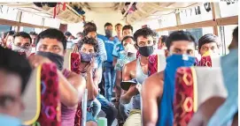  ?? PHOTO: PTI ?? Migrants from Hyderabad during their journey to West Bengal. Interstate movement of passenger vehicles and buses has been allowed, but with mutual consent of states/uts