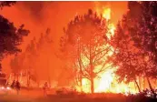  ?? — AFP ?? A fire rages in California.