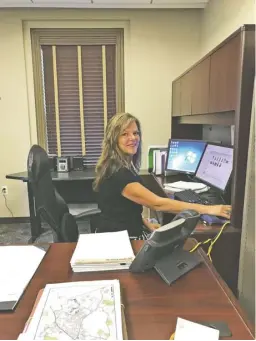  ?? COURTESY PHOTO ?? Holly Meade keeping busy behind her desk, now juggling duties for two counties, Fauquier and Rappahanno­ck.