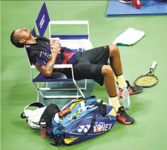  ?? Julio Cortez / Associated Press ?? Nick Kyrgios of Australia leans all the way back in his changeover chair during a break in his four-set loss to third-seeded Andy Murray at the U.S. Open.