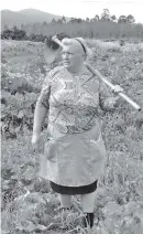  ?? PAULA VAZQUEZ VIA AP ?? Dolores Leis stands in a field on her farm in Galicia, in northern Spain. Leis has found unexpected fame on social media after many began saying she bears a striking resemblanc­e to U.S. President Donald Trump.