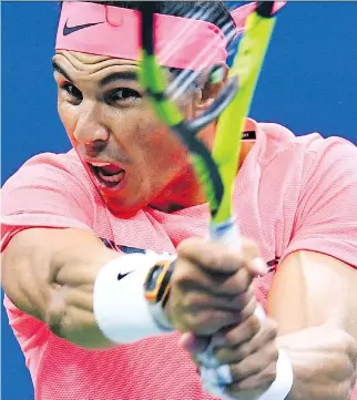  ?? JEWEL SAMAD/AFP/GETTY IMAGES ?? Rafael Nadal returns the ball to Dusan Lajovic during their U.S. Open men’s singles match in New York on Tuesday. The top-seeded Nadal won 7-6 (6), 6-2, 6-2 in the first-round matchup.