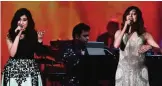  ??  ?? Bollywood singers Jonita Gandhi (left), AR Rahman (center) and Neeti Mohan perform on stage.