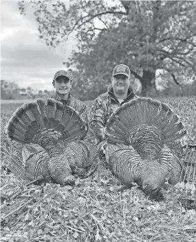  ?? CONTRIBUTE­D ?? Walker Montgomery on a turkey hunting trip with his father, Brian.