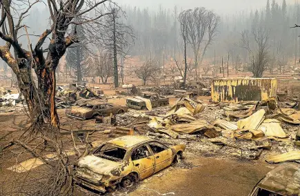  ?? AP ?? Cars and homes destroyed by the Dixie fire line central Greenville.