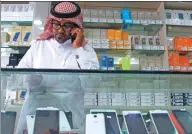  ?? FAISAL AL NASSER / REUTERS ?? A vendor speaks on his phone at a mobile shop in Riyadh, Saudi Arabia.