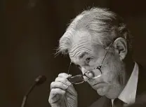  ?? Drew Angerer / Bloomberg ?? Jerome Powell, chairman of the U.S. Federal Reserve, removes his glasses during a Senate Banking, Housing and Urban Affairs Committee hearing in Washington.