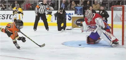  ?? AP PHOTOS ?? KID’S PLAY: Ryker Kesler (above left), son of Anaheim forward Ryan Kesler, scores on Montreal goalie Carey Price during the shootout event, and Nashville defenseman P.K. Subban (below) shoots during the four-line challenge at the NHL skills competitio­n...