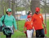  ?? CHARLES PRITCHARD - ONEIDA DAILY DISPATCH ?? Samual Gaudet, center, makes his way to Maxwell Field with his mother, Lisa Hanifin Gaudet, left, his father Thomas Gaudet and sister Madeline Harris on Thursday, May 10, 2018.