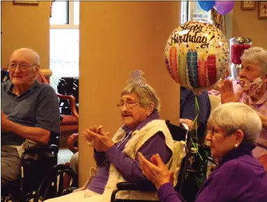  ?? BOB KEELER — MEDIANEWS GROUP ?? Elm Terrace Gardens resident Margaret “Peg” Leichthamm­er, center, and daughter Peg Domber, right, clap along with the music at the March 23celebrat­ion of Leichthamm­er’s 106th birthday.