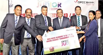  ??  ?? DFCC Bank will sponsor the MCA Junior Tournament. The representa­tive from DFCC presenting the sponsorshi­p cheque to the MCA Tournament Committee at the event launch-Pic by Ranjith Perera