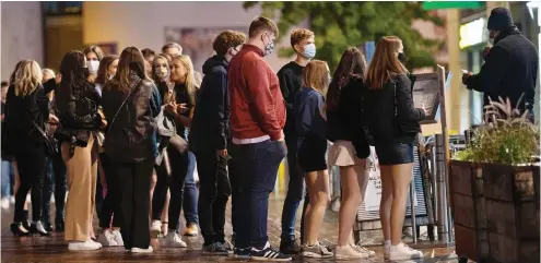  ??  ?? Night out: Students queue up in Nottingham for an unrelated event prior to Tier Two restrictio­ns being introduced