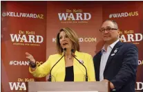  ?? DAVID KADLUBOWSK­I — THE ARIZONA REPUBLIC VIA AP, FILE ?? Kelli Ward, with her husband Michael Ward, concedes to Sen. John McCain, R-Ariz., in the race for the Republican nomination to U.S. Senate, Aug. 30, 2016, in Scottsdale, Ariz. Ward and her husband are two of 11Republic­ans charged Wednesday with conspiracy, fraud and forgery, marking the fourth state to bring charges against “fake electors.”