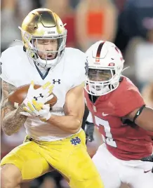  ?? ?? Braden Lenzy gets past Stanford’s Kyu Blu Kelly for a touchdown