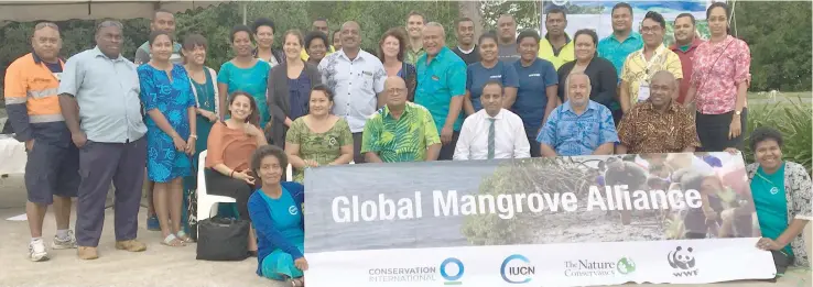  ?? Photo: Swashna Chand ?? Ministry of Local Government, Housing and Environmen­t permanent secretary Joshua Wycliffe (seated fourth from left) with members and participan­ts of Global Mangrove Alliance at My Suva Picnic Park in Suva on July 26, 2018.