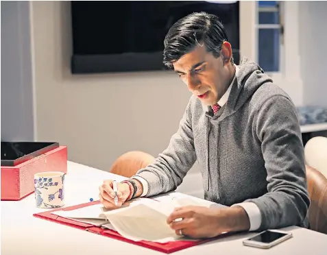  ??  ?? Rishi Sunak works on his Spending Review speech in 11 Downing Street. The Chancellor is to spell out his New Deal-style package to get one million people back into work