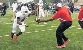  ?? DAVID FURONES/STAFF ?? “I just know this is my last game, so I want to go out with a bang,” says ChaminadeM­adonna running back and Auburn commit Shaun Shivers, left.