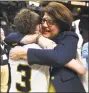  ?? Lori Van Buren / Albany Times Union ?? Quinnipiac coach coach Tricia Fabbri hugs Adily Martucci after the team defeated Rider for the MAAC title on Feb. 6, 2017.