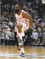  ?? Morry Gash / Associated Press ?? Houston guard James Harden exults during the second half against the Bucks in Milwaukee.