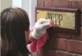  ??  ?? LONDON: A company plaque is cleaned outside the offices of British advertisin­g giant WPP in London yesterday. The British advertisin­g giant WPP has downgraded its growth forecast for 2017 because of a slowdown in the market, causing a fall of over 10...