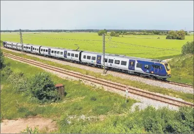  ??  ?? The first of Northern’s new fleet makes its debut run on the track, on the West Coast Mainline from Warrington to Carnforth.