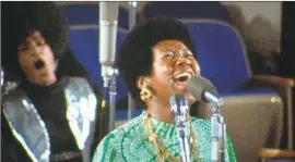  ?? Amazing Grace Movie LLC ?? ARETHA FRANKLIN records a gospel tune in a still from “Amazing Grace,” shot during the same-titled album’s 1972 recording and released years later.