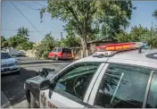  ?? Bobby Block/The Signal ?? Deputies from the Santa Clarita Valley Sheriff’s Station rerouted traffic on Race Street in Newhall Thursday morning after a large tree branch fell on an SUV parked on the street.