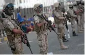  ??  ?? Houthi Shia fighters stand guard during a rally to mark the third anniversar­y of the Houthis’ takeover of the Yemeni capital, in Sanaa.